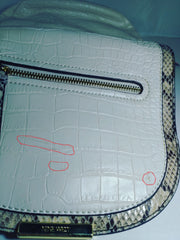 Nine West cream snakeskin crossbody bag close-up showing texture and design details.